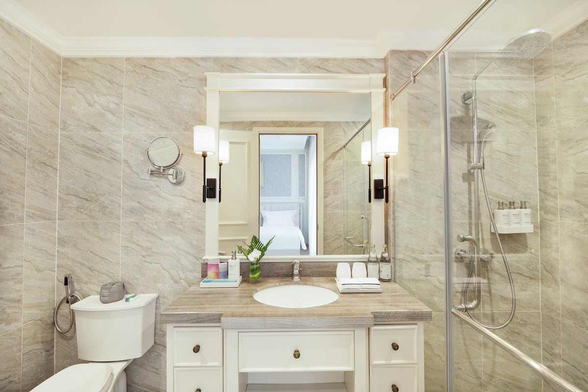 separate bathtub and shower, designer toiletries, hair dryer, slippers