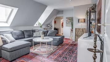 Family Condo | Área de estar | TV 50 polegadas com canais digitais