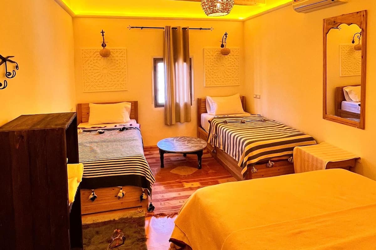 Chambre triple Confort | Draps italiens de Frette, literie de qualité