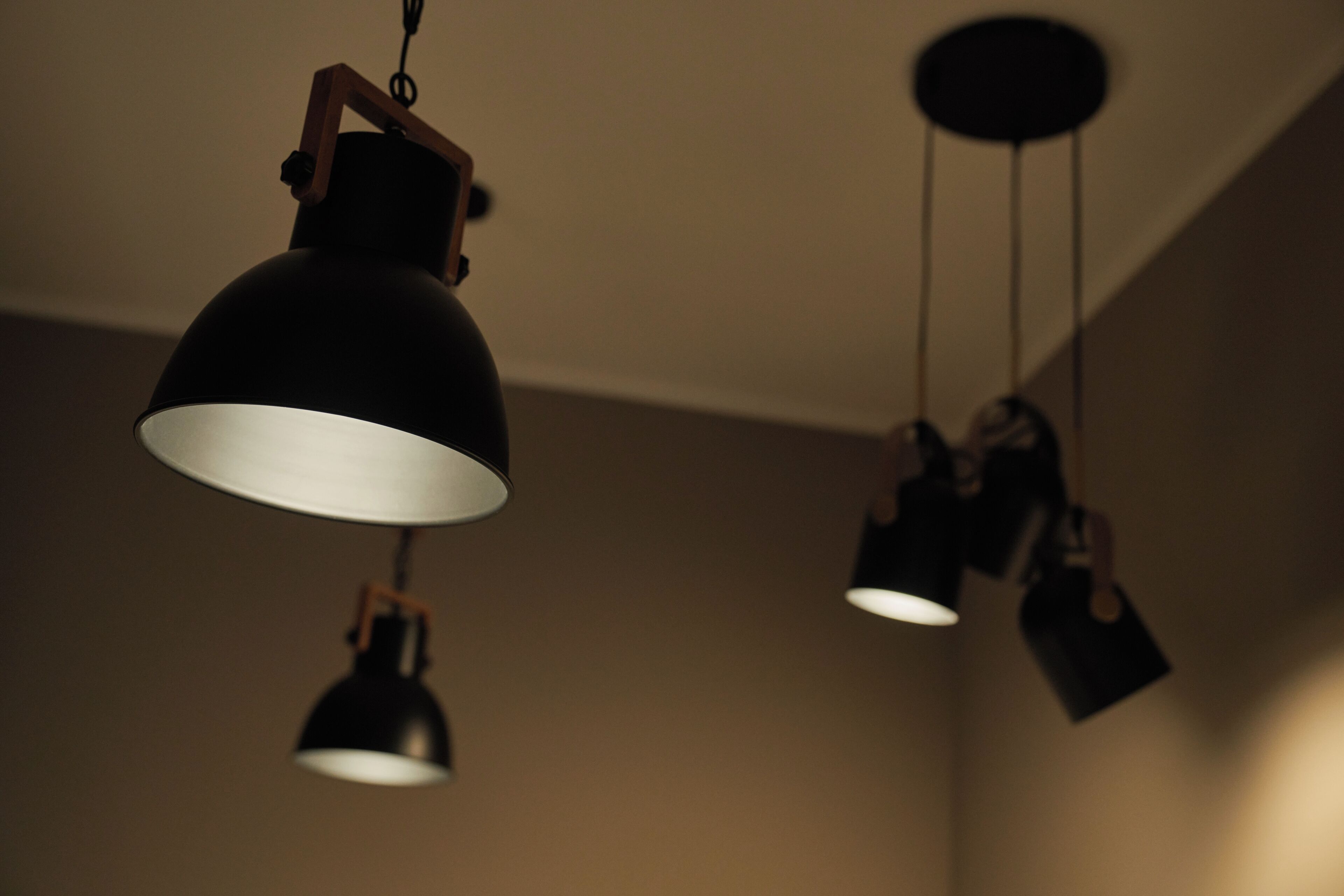 A ceiling with three hanging pendant lights.