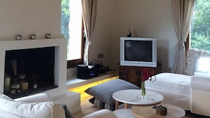 Villa, 2 Bedrooms | Living room | Flat-screen TV, fireplace, video-game console, DVD player - Villa Thermi (Lesvos)