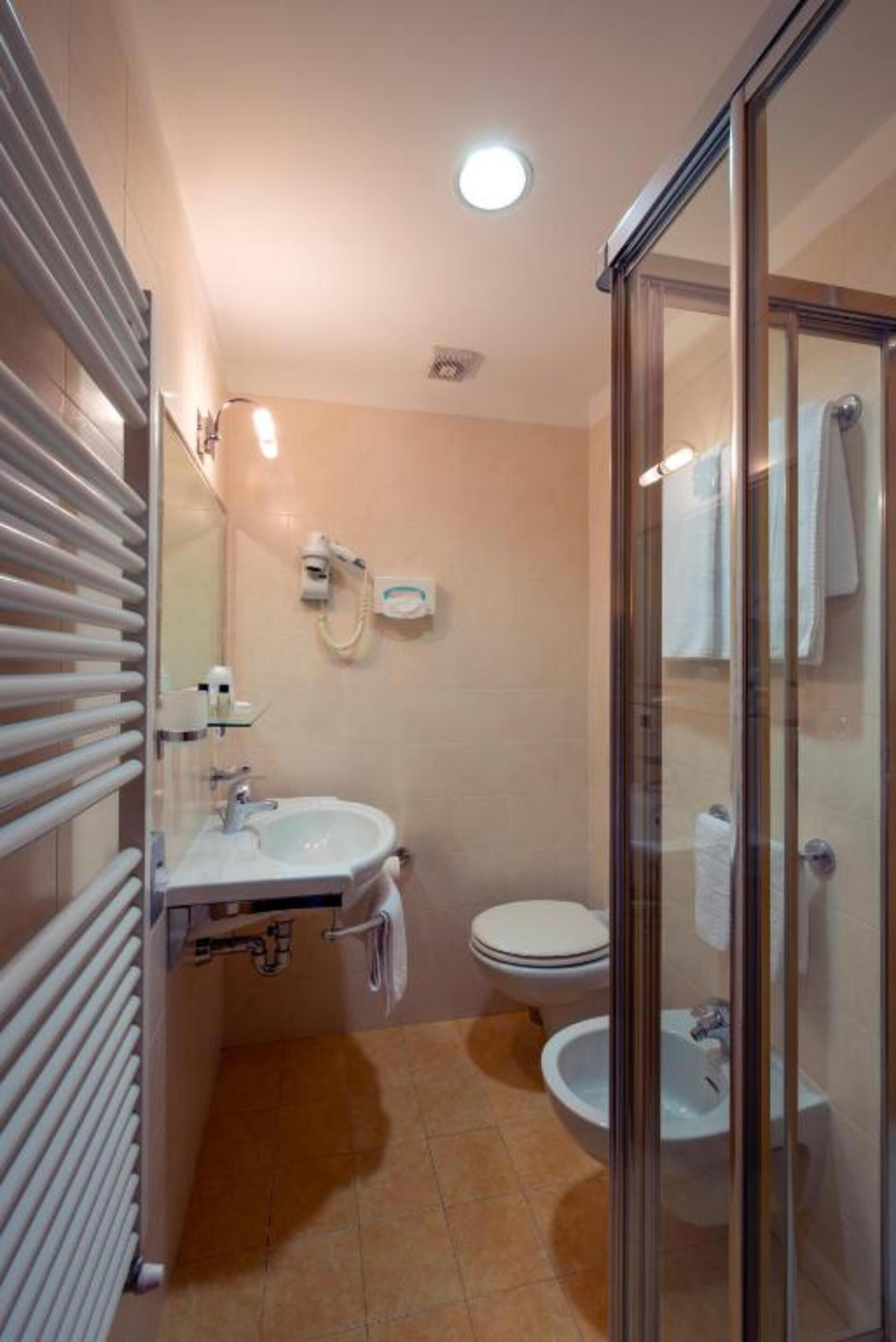 standard double or twin room | bathroom | deep-soaking bathtub, rainfall showerhead, hair dryer, bidet