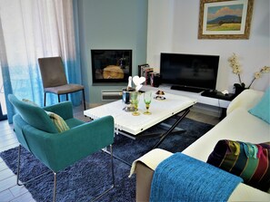 Studio, Sea View, Ground Floor (Euphoria) | Living area | 40-inch flat-screen TV with satellite channels, TV, DVD player - Seacret Apartments (Aigialeia)