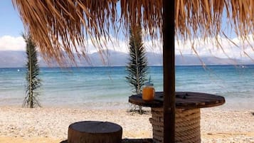 On the beach, sun loungers, beach umbrellas