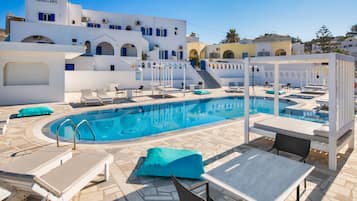 Seasonal outdoor pool, open 10:00 AM to 8:00 PM, pool umbrellas