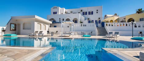 Seasonal outdoor pool, open 10:00 AM to 8:00 PM, pool umbrellas