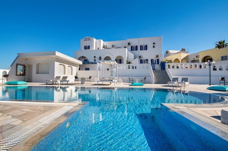 Seasonal outdoor pool, open 10:00 AM to 8:00 PM, pool umbrellas. Villa Kavallaris & Apartments