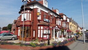 A row of terraced houses with a pub on the ground floor. - The Revelstoke Hotel (Bridlington)