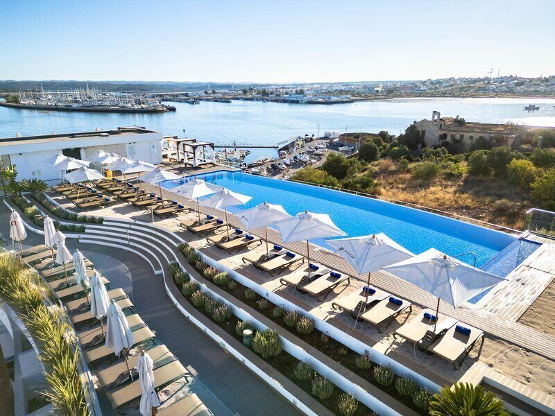 Indoor pool, outdoor pool, pool umbrellas, sun loungers