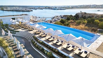 Indoor pool, outdoor pool, pool umbrellas, sun loungers