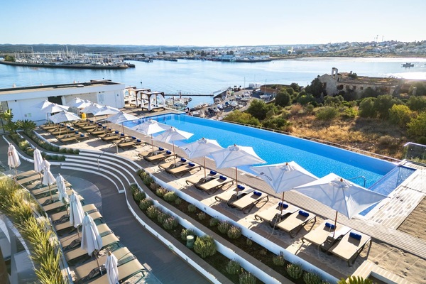 Indoor pool, outdoor pool, pool umbrellas, sun loungers