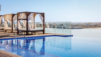 Indoor pool, outdoor pool, pool umbrellas, sun loungers