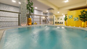 A large indoor pool with a tiled wall and a wooden panel wall. - Aurea Fátima Hotel Congress & Spa (Ourem)