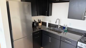 Luxury Cabin | Private kitchen | Full-size fridge, microwave, stovetop, coffee/tea maker