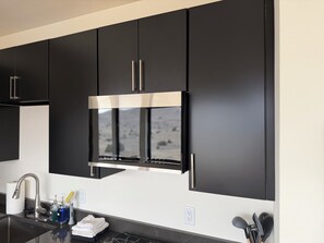Deluxe Cabin | Private kitchen | Full-sized fridge, microwave, stovetop, coffee/tea maker