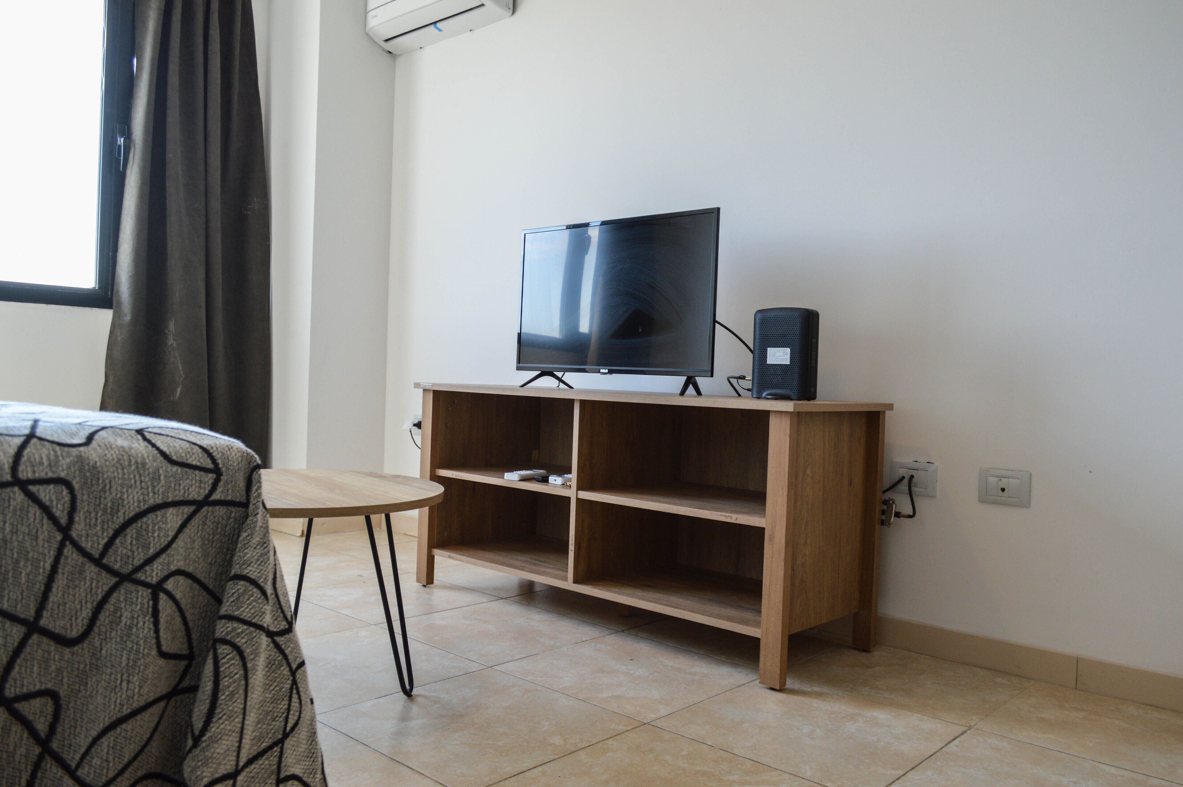 apartment, 2 bedrooms | living area | 32-inch flat-screen tv with cable channels, tv, heated floors