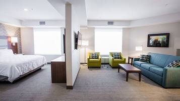 Suite, 1 King Bed, Jetted Tub | Desk, blackout drapes, soundproofing, iron/ironing board