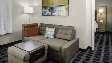 Hypo-allergenic bedding, desk, laptop workspace, blackout drapes