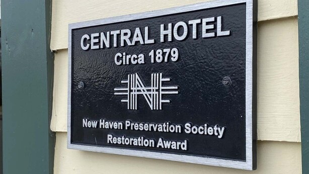 A sign for the Central Hotel, indicating it was established around 1879. The sign is awarded by the New Haven Preservation Society for restoration. - Central Hotel (New Haven)