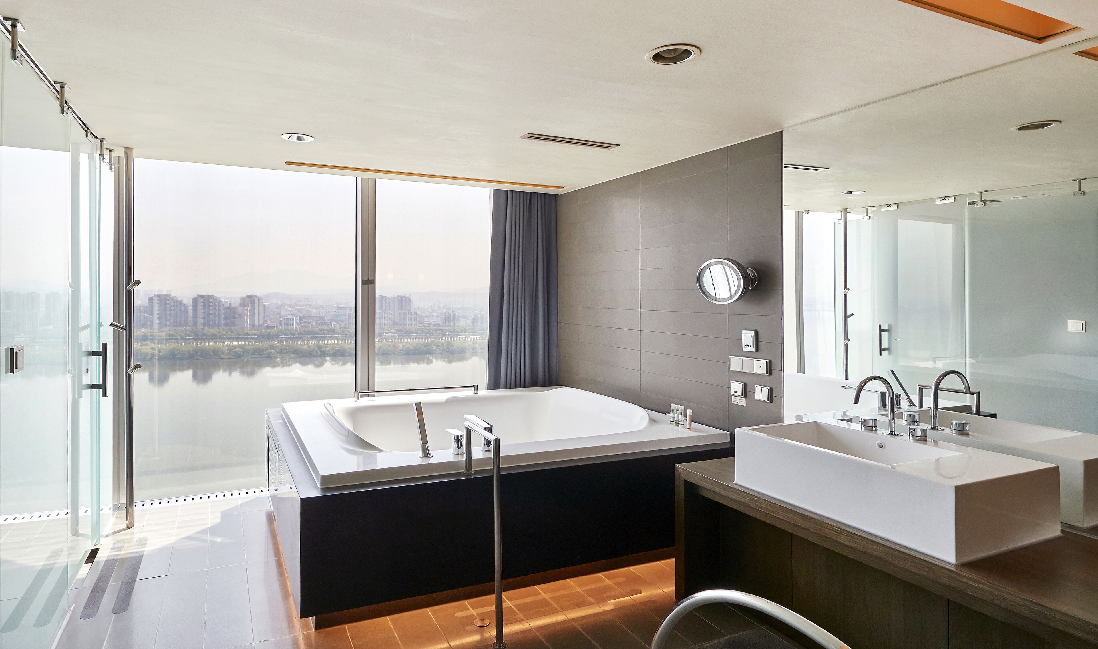 spa deluxe double room, river view | bathroom | separate bathtub and shower, rainfall showerhead, free toiletries