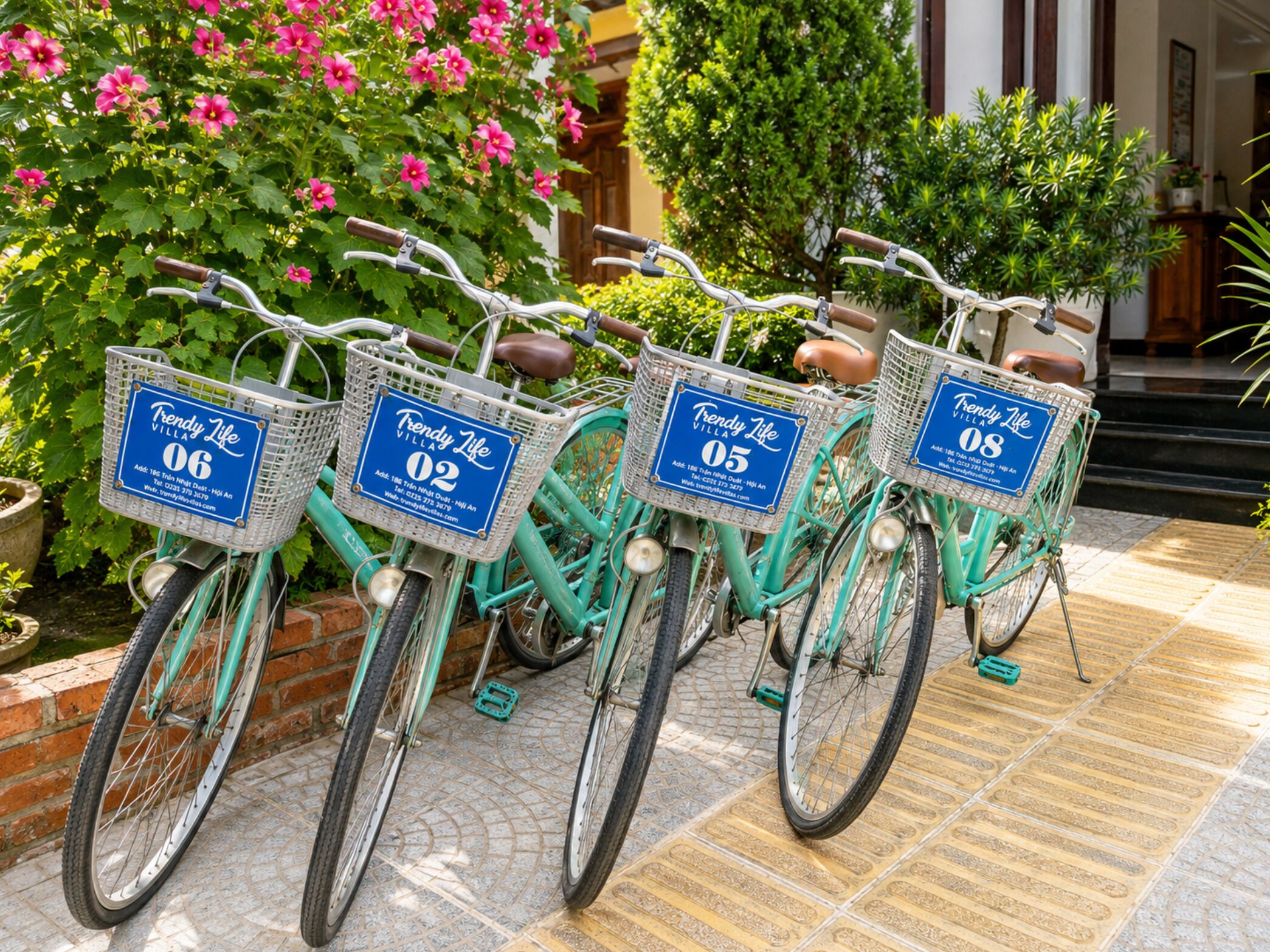 Four bicycles with baskets, each labeled with a number and the name 'Trendy Life Villa.'