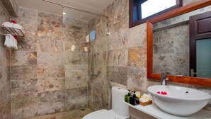 A bathroom with a glass shower enclosure, a white toilet, and a vanity with a large sink and mirror. - Trendy Life Villa Hoi An (Da Nang)