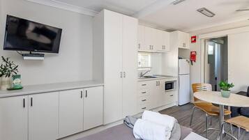 Sandpiper Cabin (Triple Bunk) | Living area | Flat-screen TV, DVD player