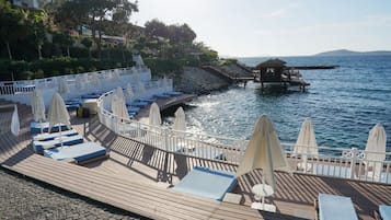 Private beach, white sand, free beach shuttle, sun-loungers