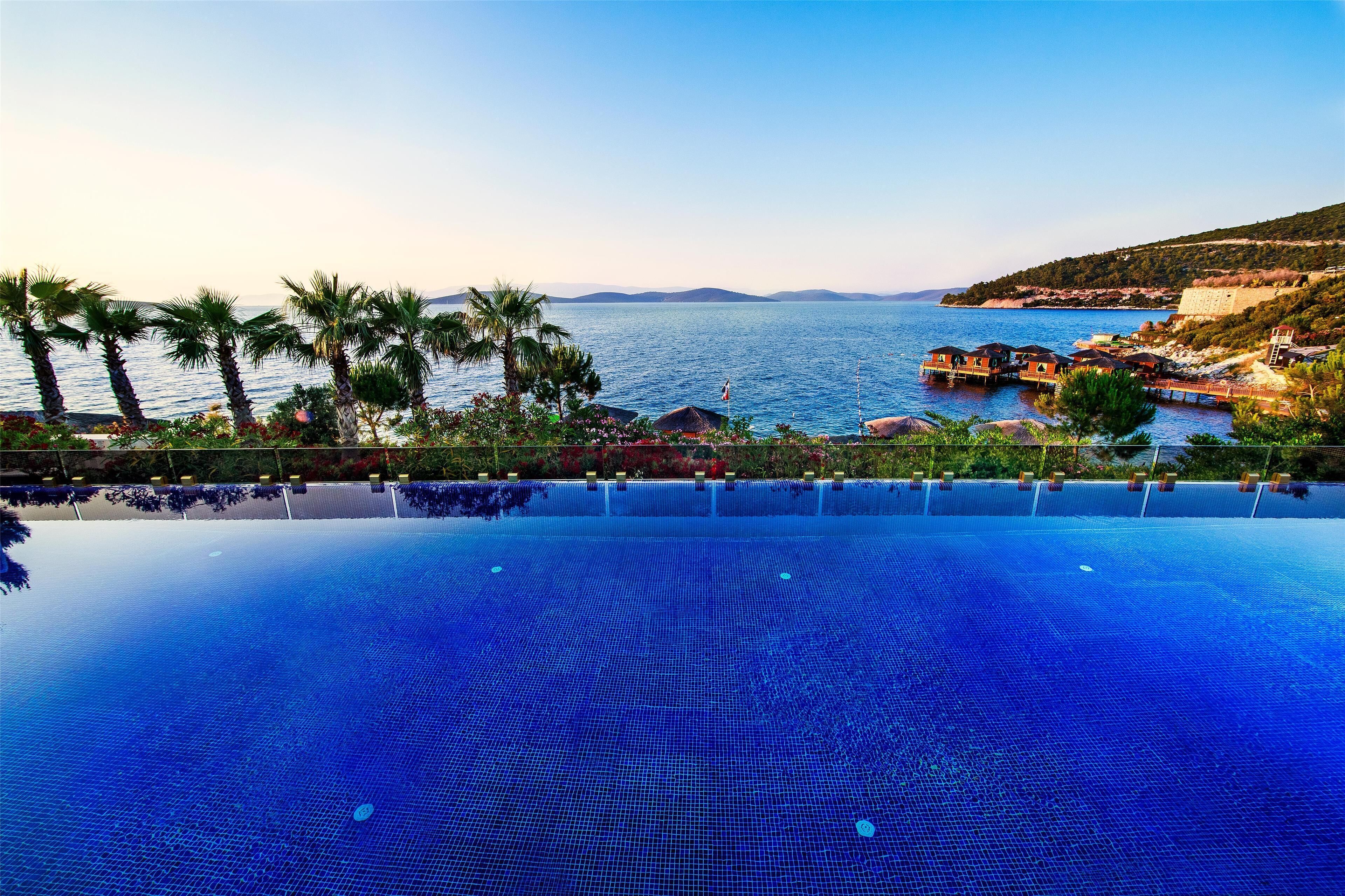 Indoor pool, seasonal outdoor pool, pool umbrellas, pool loungers