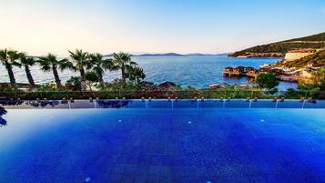Indoor pool, seasonal outdoor pool, pool umbrellas, pool loungers