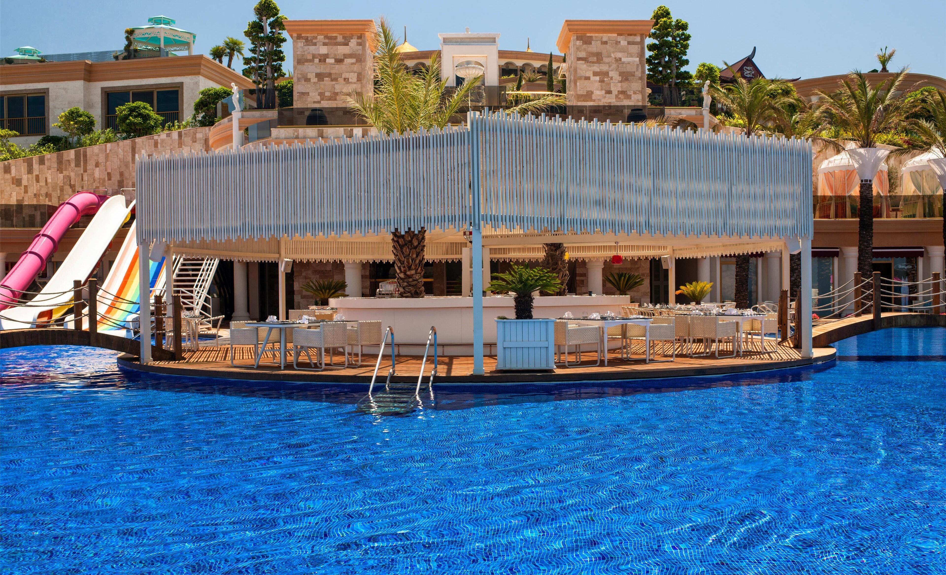 6 bars/lounges, poolside bar, beach bar