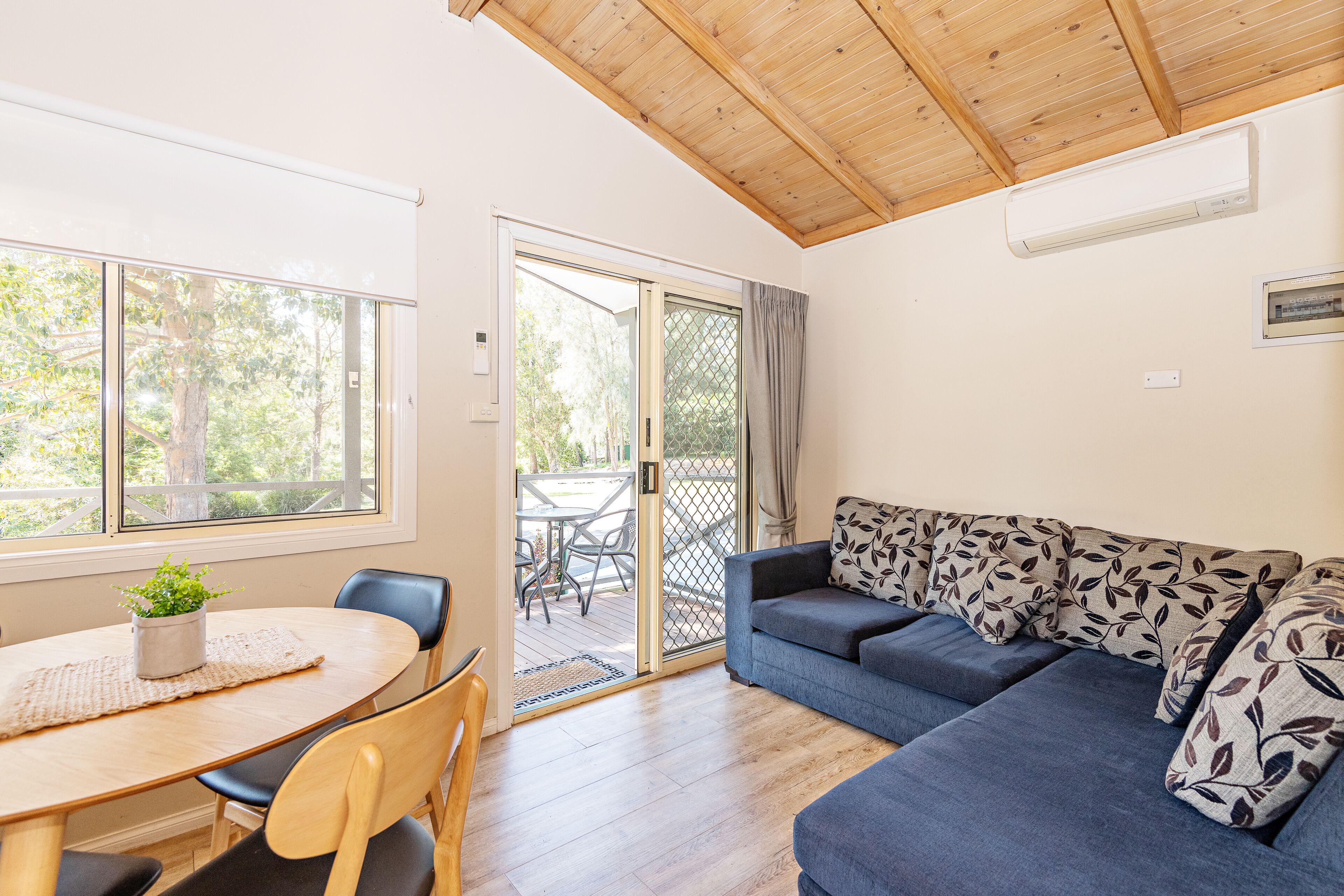 Shoalhaven Deluxe Cabin (Double + Single Bunk)  | Living area | Flat-screen TV