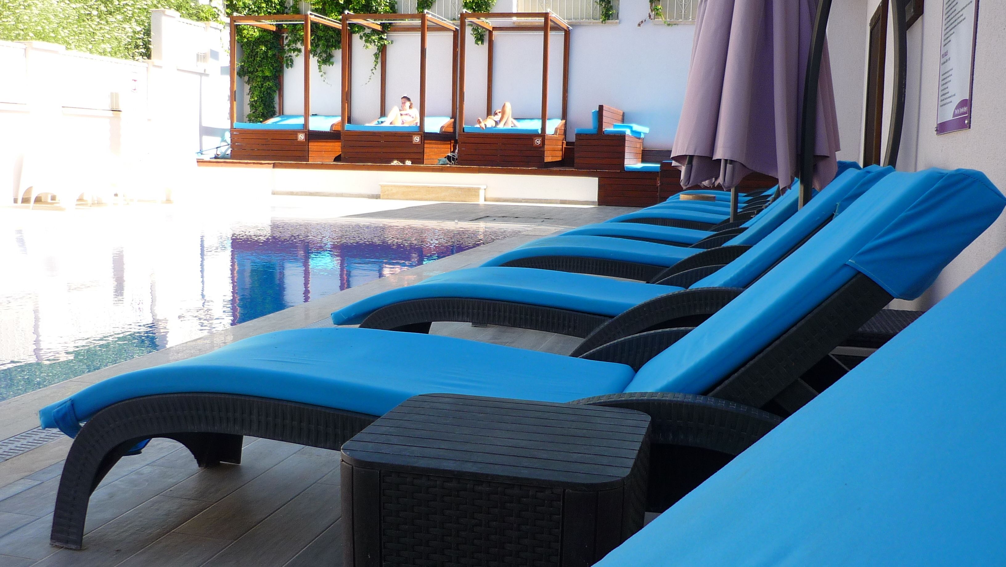 Outdoor pool, open 9:00 AM to 6:00 PM, pool umbrellas, pool loungers
