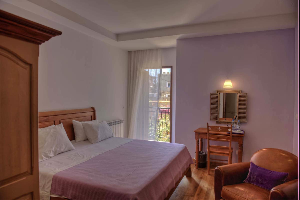 Deluxe Double Room, Balcony, City View | Minibar, in-room safe, soundproofing, iron/ironing board