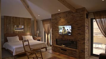 Suite estudio, 1 cama de matrimonio grande, terraza, vistas a la ciudad | Minibar, caja fuerte, sistema de insonorización