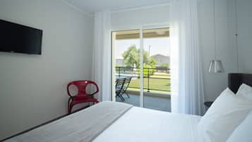 Apartment, 1 Bedroom, Garden View | Premium bedding, in-room safe, iron/ironing board, free WiFi