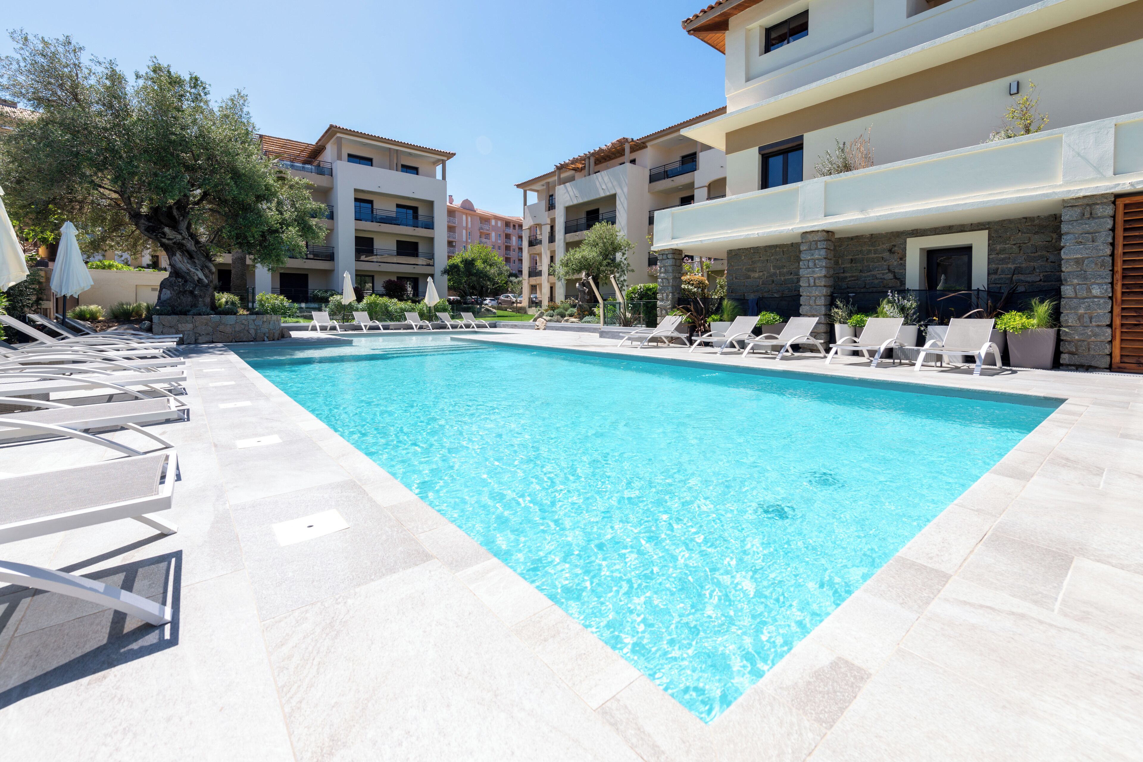 2 outdoor pools, pool umbrellas, pool loungers