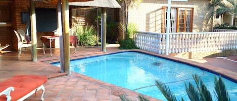 Seasonal outdoor pool, pool umbrellas, sun loungers