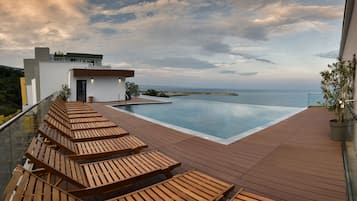 Indoor pool, outdoor pool, open 9:00 AM to 6:00 PM, pool umbrellas