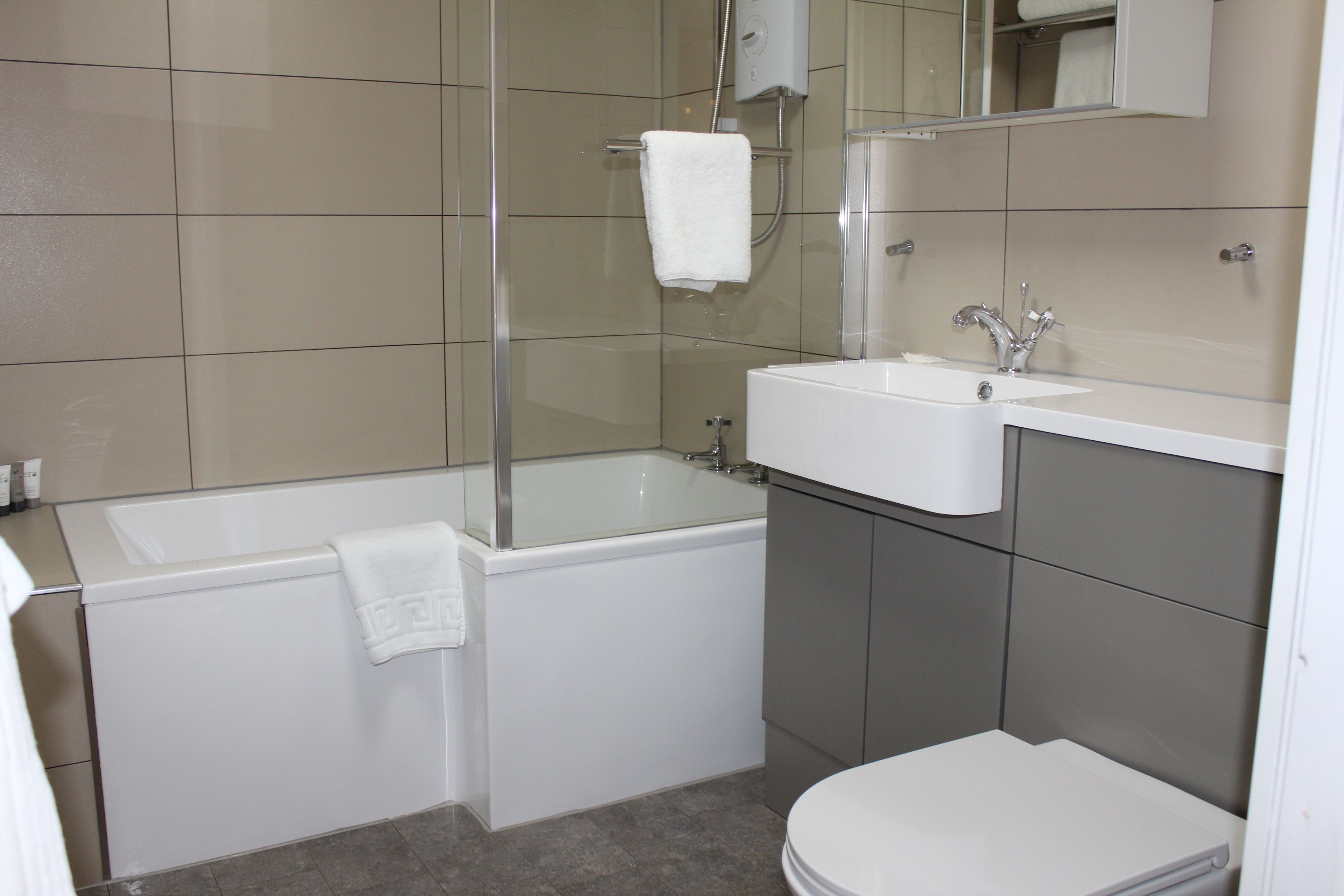 luxury apartment, 1 bedroom, garden view | bathroom | combined shower/bathtub, free toiletries, hair dryer, towels
