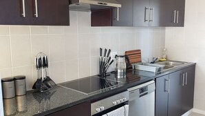 Classic Apartment, 2 Bedrooms, Partial Ocean View | Private kitchen | Coffee/tea maker, full-size fridge, microwave, oven - Bramber Court Apartments (Cape Town)
