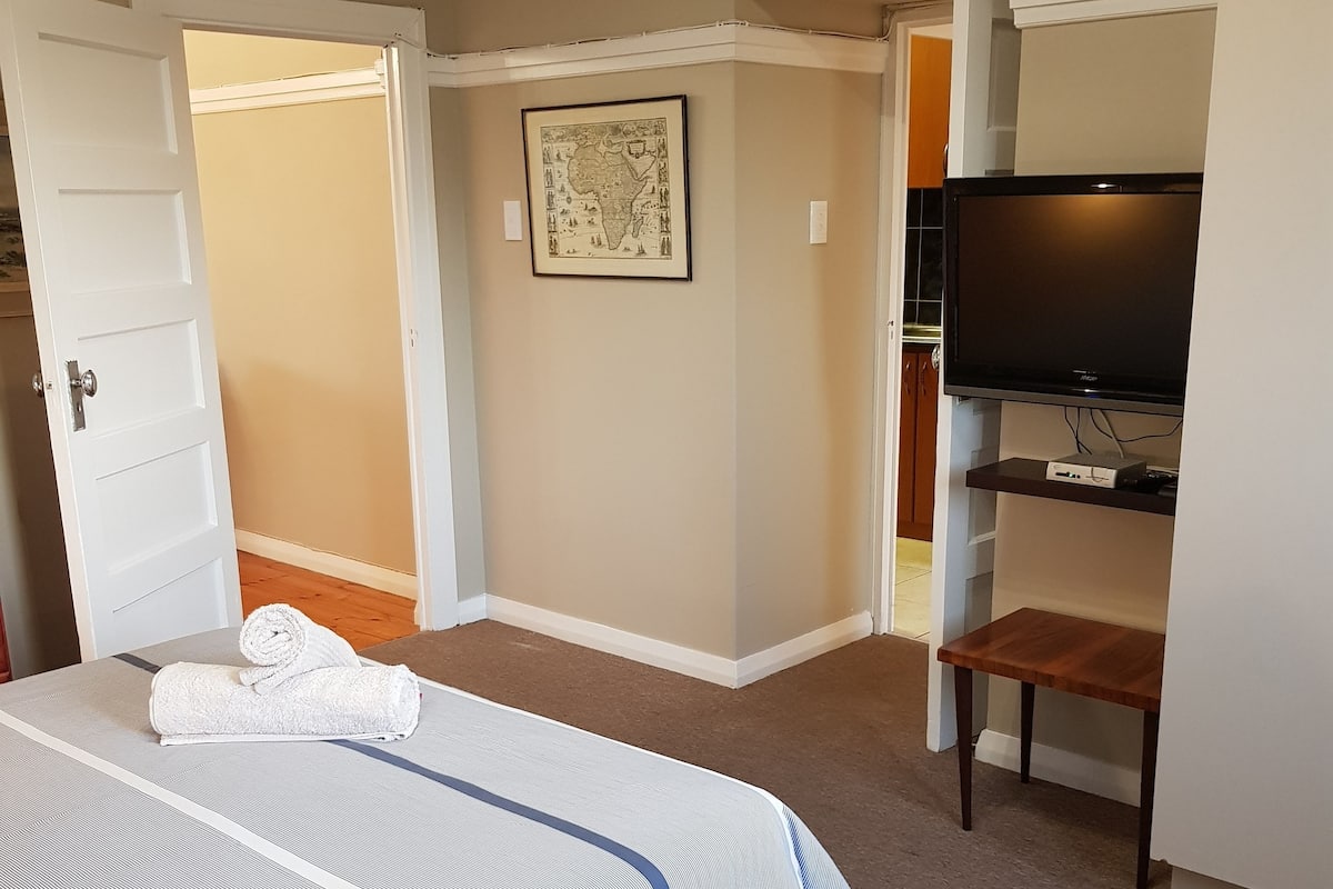 Classic Apartment, 2 Bedrooms, Partial Ocean View | 1 bedroom, in-room safe, laptop workspace, iron/ironing board
