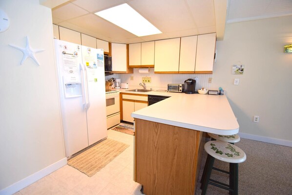 Condo, 2 Bedrooms | Private kitchen | Fridge, microwave, dishwasher, coffee/tea maker