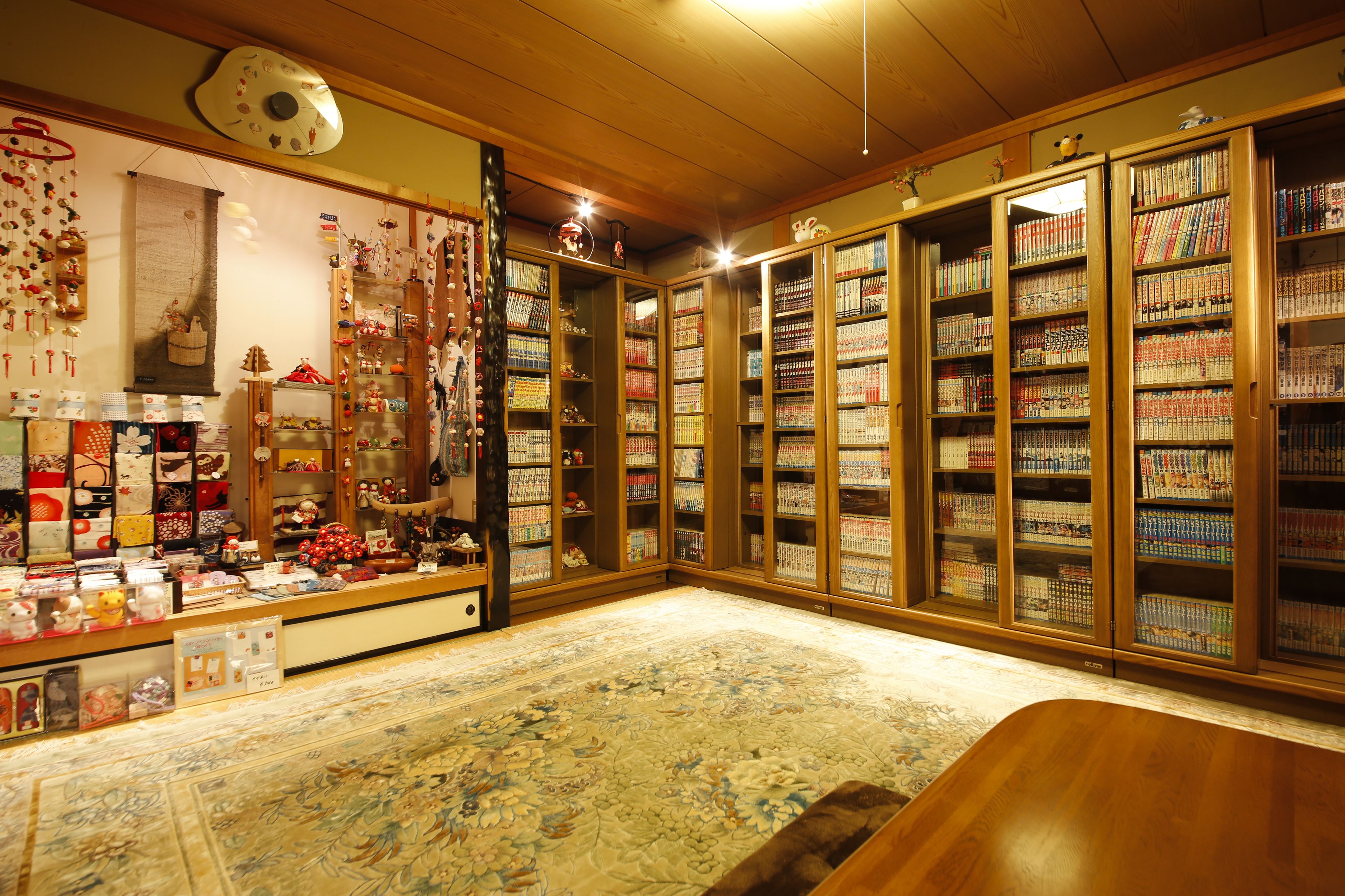 A library with wooden bookshelves and a carpeted floor.