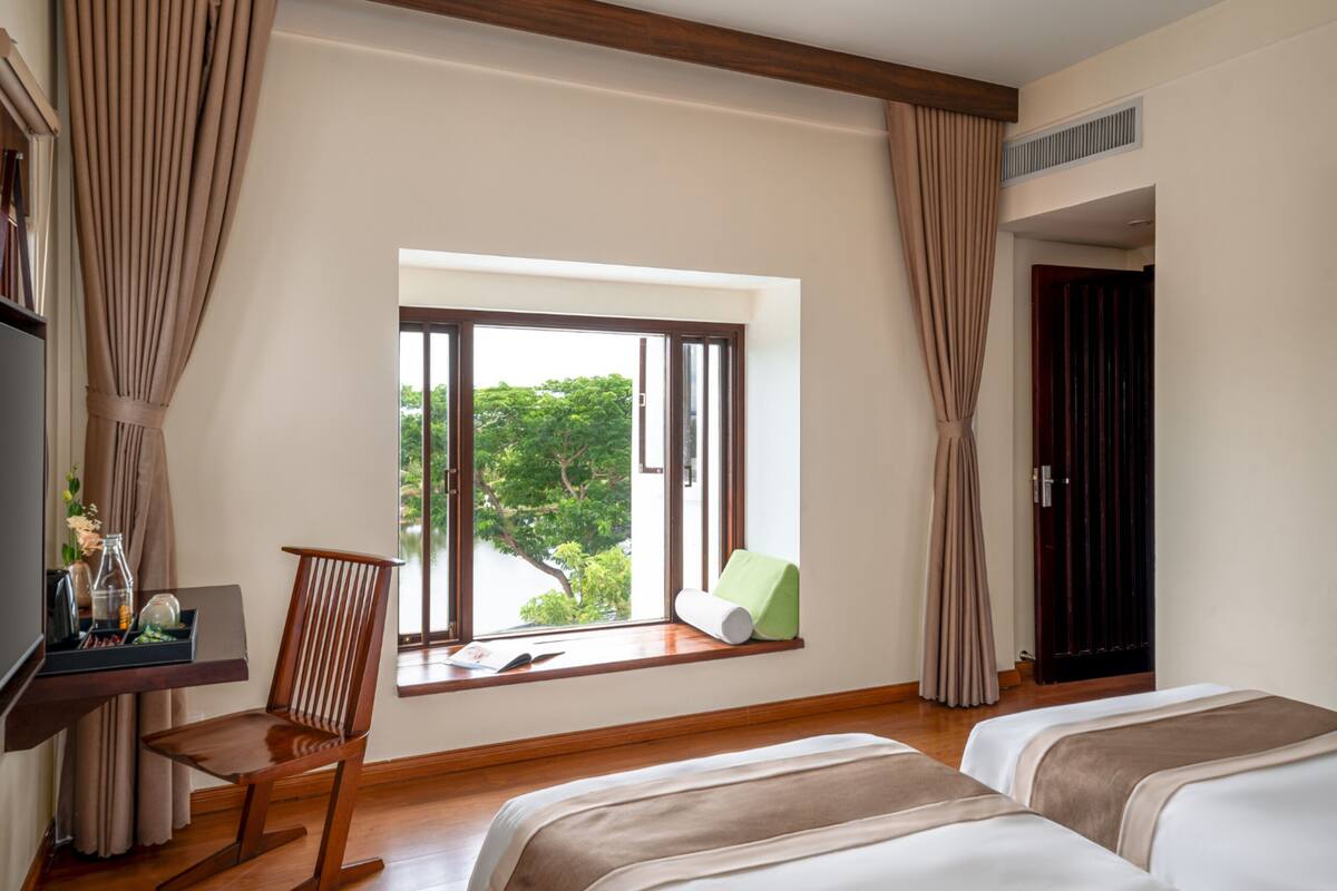 Grand Twin Room, River View | Minibar, in-room safe, desk, laptop workspace
