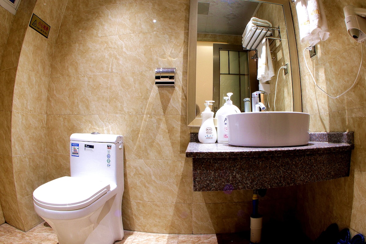 deluxe family room | bathroom | shower, free toiletries, hair dryer, dressing gowns