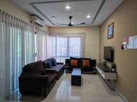 Premium Apartment, 2 Bedrooms, Balcony, City View | Living area | 40-inch Smart TV with cable channels, TV