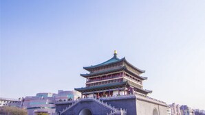A traditional multi-tiered building with a green roof, likely a historical or cultural site. - Golden Tree Business Hotel (Xi'an)