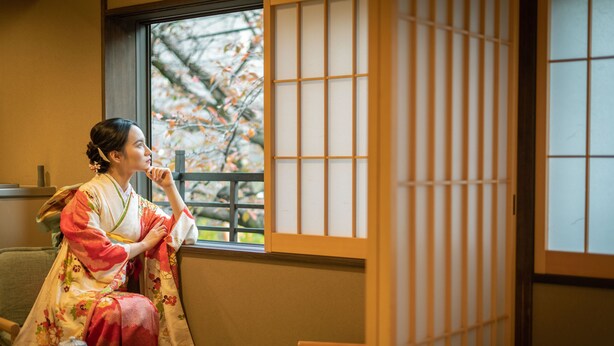 A traditional Japanese room with tatami flooring, a low table, and a sliding door. - KumoMachiya Takasegawa (Kyoto)