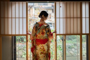 A traditional Japanese room with tatami flooring and shoji screens.